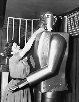 Robot Prints: Woman Lights Cigarette For Elektro