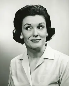 Raised Eyebrow Prints: Woman looking away, posing in studio, (B&W), (Portrait)