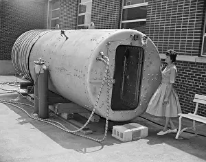 Chamber Prints: Woman Looking Over Compression Tank