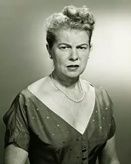 Pearl Collection: Woman looking displeased, (B&W), portrait