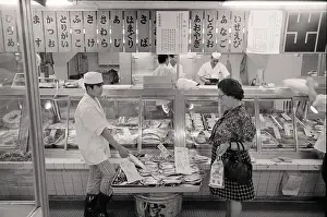 Pollution Prints: Woman Looking @ Fish In Fish Market;Japa