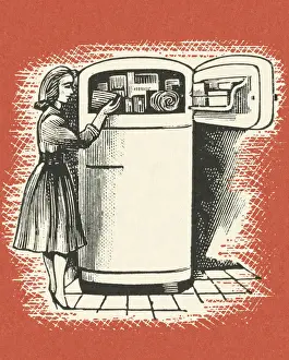 Woman Looking In Freezer