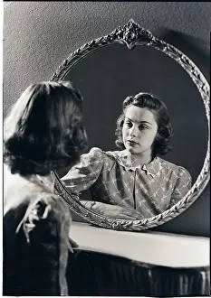 Woman Looking into Mirror