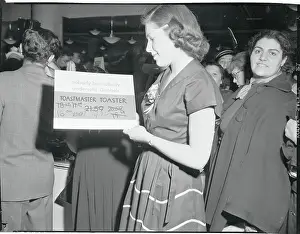 Woman Looking at a Price Card