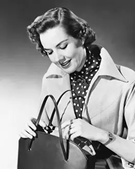 Purse Prints: Woman looking into purse