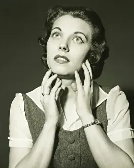 Worried Prints: Woman looking up in studio, (B&W), portrait