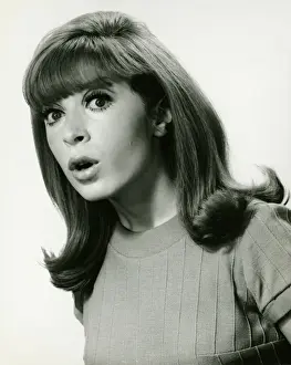 Raised Eyebrow Prints: Woman looking surprised, posing in studio, (B&W), portrait