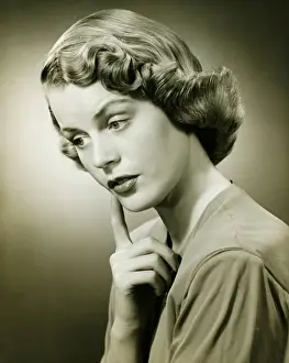 Wondering Prints: Woman looking thoughtful, posing in studio, (B&W), (Portrait)