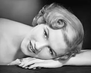 Woman lying with head on hand, (B&W), (Close-up), (Portrait)