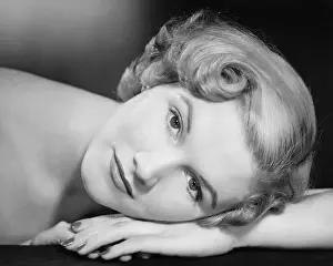 Woman lying with head on hand, (B&W), (Close-up), (Portrait)