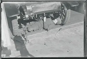 Woman Machinist Under Car