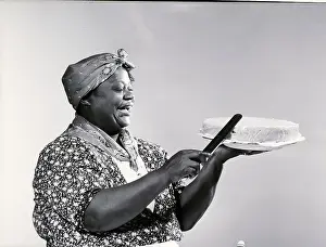 Stereotypes Prints: Woman in Mammy Costume Frosting Cake