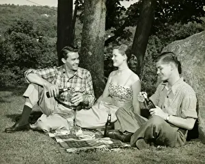 Sandwich Prints: Woman and two men picnicking, (B&W)