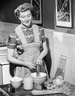 Woman mixing ingredients in bowl