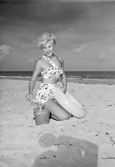 Modeling Prints: Woman Modeling A Bathing Suit On Beach
