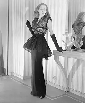 Peplum Prints: Woman Modeling Dramatic Lace Dress