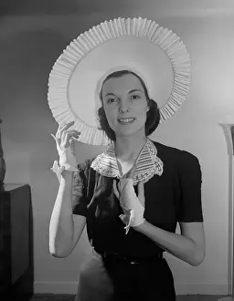 Gray Background Prints: Woman Modeling Hat and Gloves