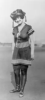 Woman Modeling Sailor Style Bathing Suit and Cap