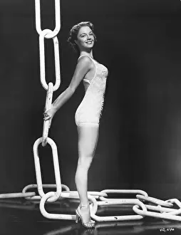 Modeling Prints: Woman Models a Bathing Suit/Large Chain