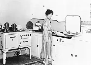 Woman at Modernized Farm Kitchen Sink