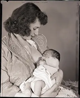 Woman Nursing Infant
