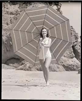 Woman Parades with Large Umbrella