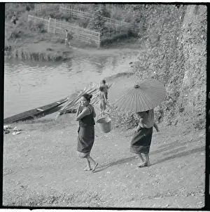 Woman with parasol Walking by River