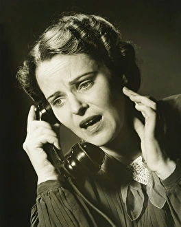 35 39 Years Collection: Woman on phone in studio, (B&W), close-up, portrait