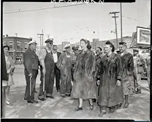 Woman Picketers in Grease-Covered Coats