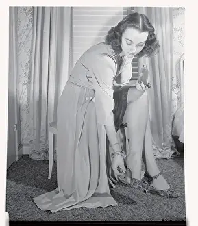 Woman Placing Perfumed Pad Inside Shoe