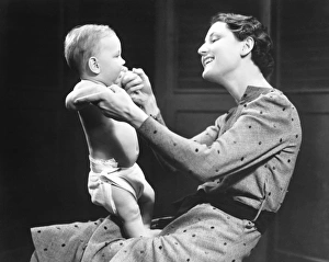 Support Gallery: Woman playing with baby (6-9 months) (B&W)