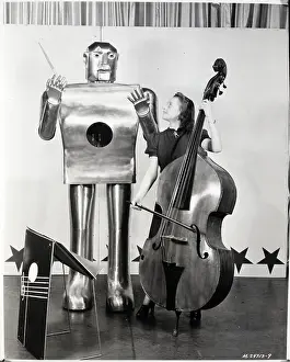 Retrofuturism Prints: Woman Playing Cello as Robot Conducts
