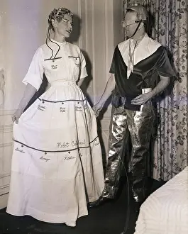 Woman in Forty Pocket Dress with Man in Atomic Suit