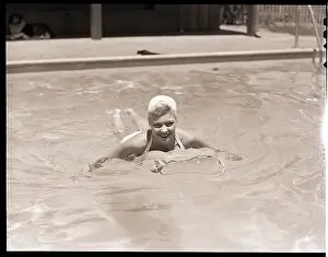 Floating Prints: Woman in a Pool with an Air Mattress