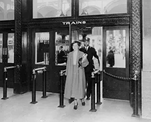 Penn Station: Echoes of Transit: Woman And Porter At Penn Station