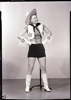 Miniskirt Prints: Woman Poses in Cowgirl Outfit