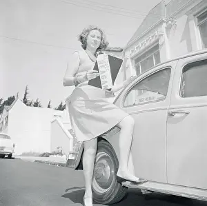 Woman Posing Next to a Car