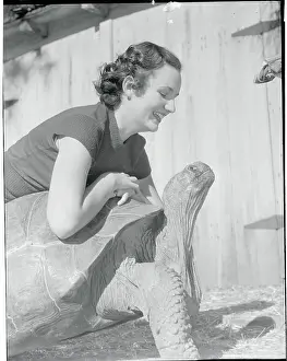 Woman Posing with Giant Tortoise