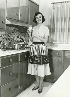 House Interior Prints: Woman posing in kitchen, (B&W), portrait