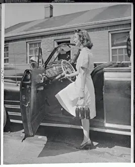 Woman Posing with New Bottle Carrier by Her Car
