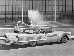 Sedan Prints: Woman Posing with Oldsmobile Super 88 Holiday