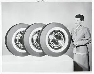 Woman Posing Next to Tires