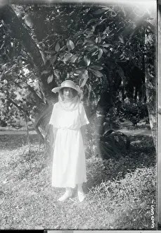Woman Posing in Front of a Tree