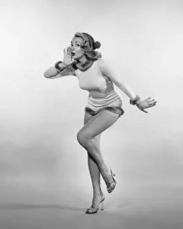 Woman posing, wearing leotard