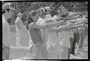 Woman Practicing Firing a Gun