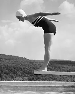 Woman preparing to dive into pool