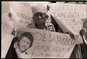Grandson Prints: Woman Protests Grandson's Disappearance