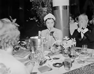 Socialite Prints: Woman Putting on Lipstick at Restaurant