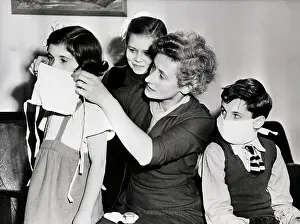 Woman Putting Mask On Children; Smog