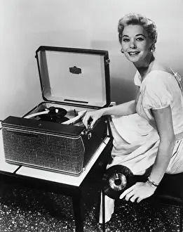 Woman with RCA Portable Victrola Record Player